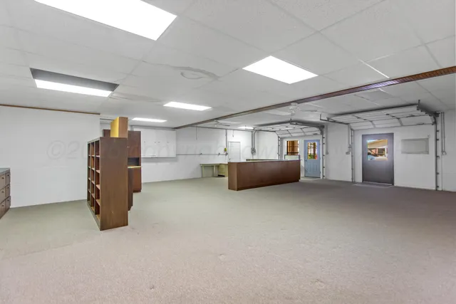 a big room with closet and windows