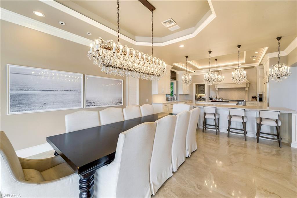 2300 Kingfish Road Naples, FL 34102 - Photo 16 of 36 a view of a dining room with furniture