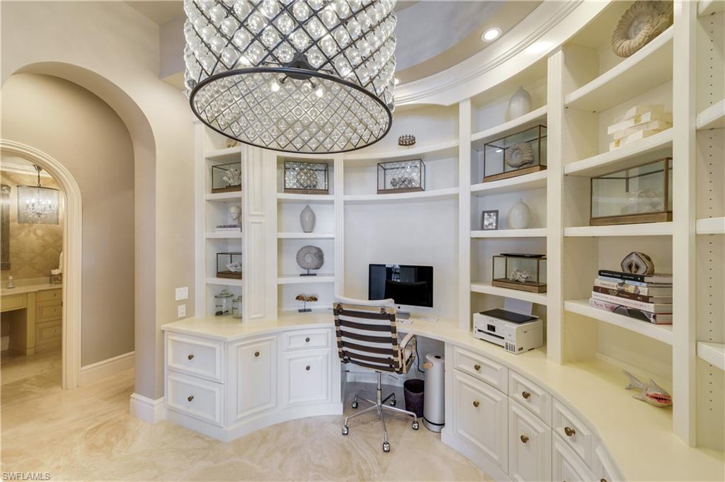 2300 Kingfish Road Naples, FL 34102 - Photo 18 of 36 a kitchen with cabinets and wooden floor