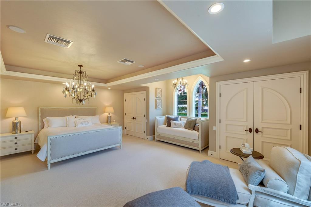 2300 Kingfish Road Naples, FL 34102 - Photo 29 of 36 a living room with furniture and a chandelier