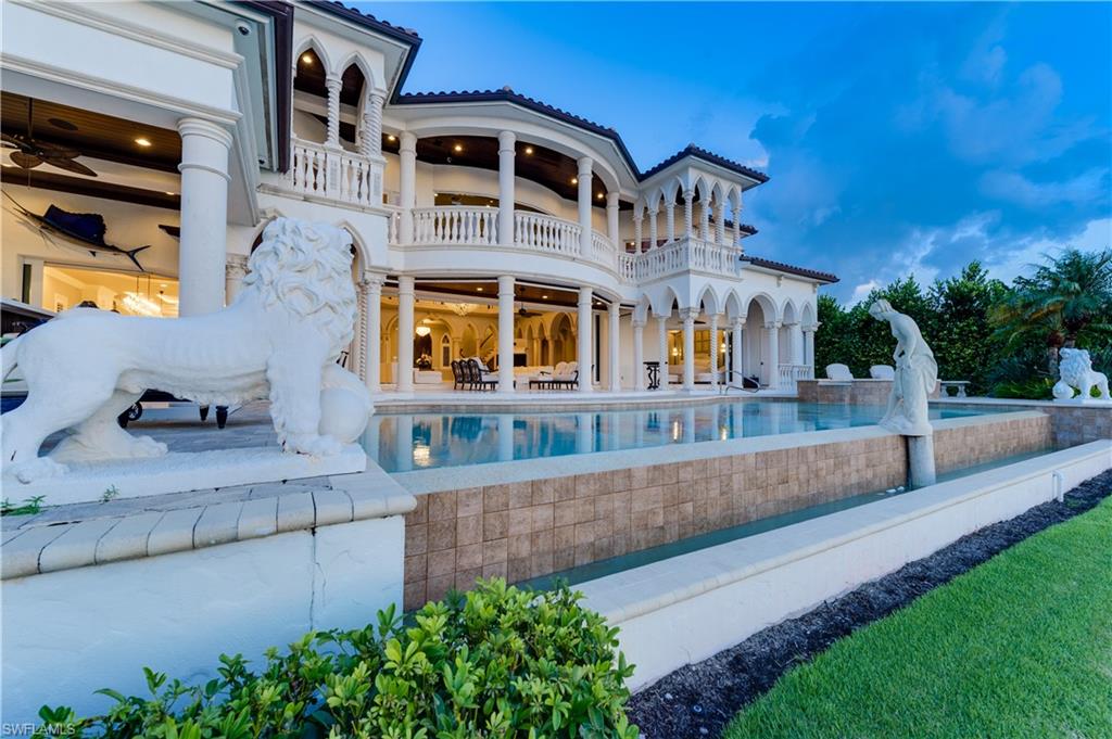 2300 Kingfish Road Naples, FL 34102 - Photo 36 of 36 a view of a building with a garden and pathway