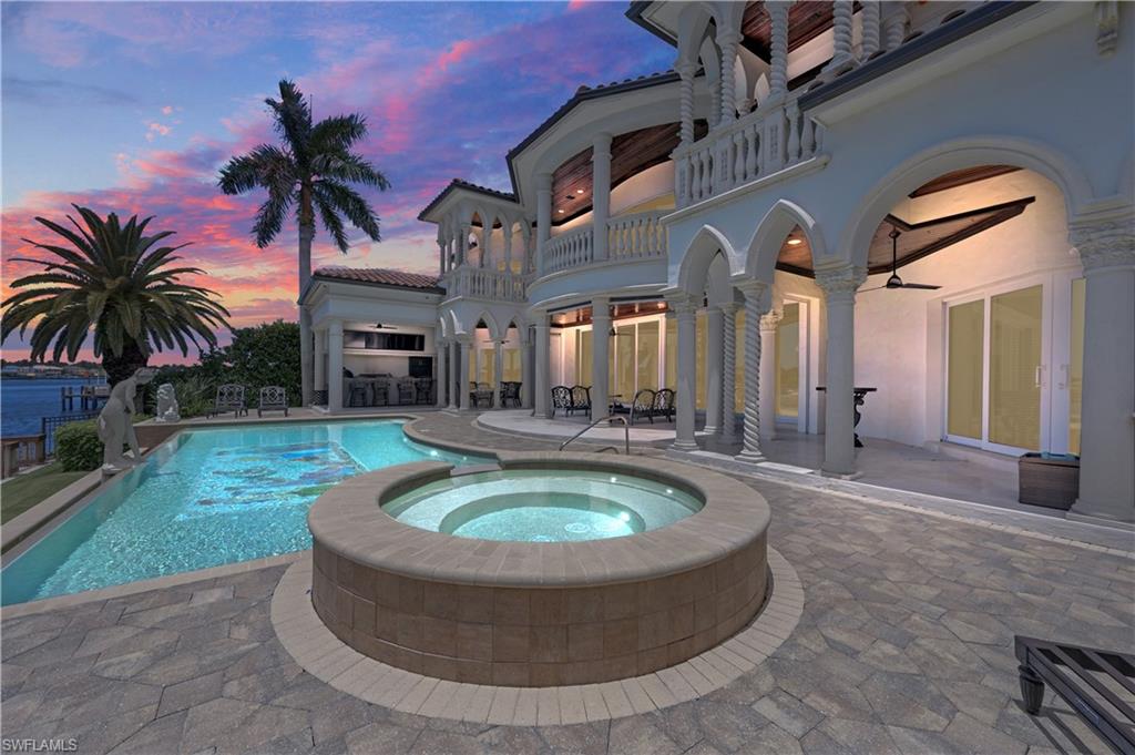 2300 Kingfish Road Naples, FL 34102 - Photo 4 of 36 a view of a house with swimming pool and porch