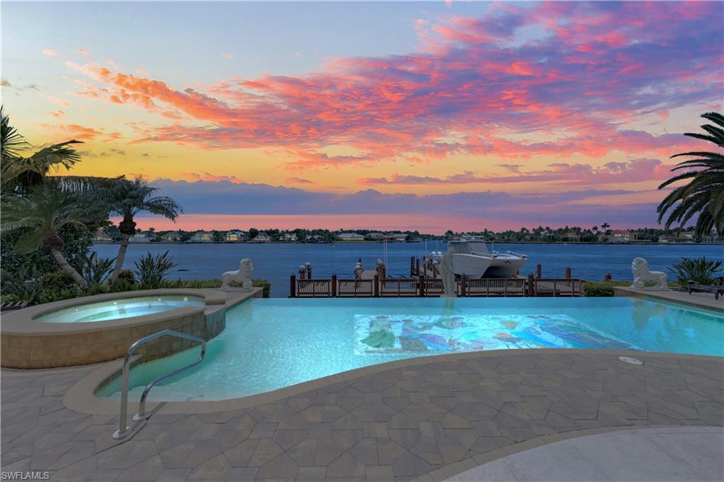 2300 Kingfish Road Naples, FL 34102 - Photo 6 of 36 a view of a patio with a table and chairs