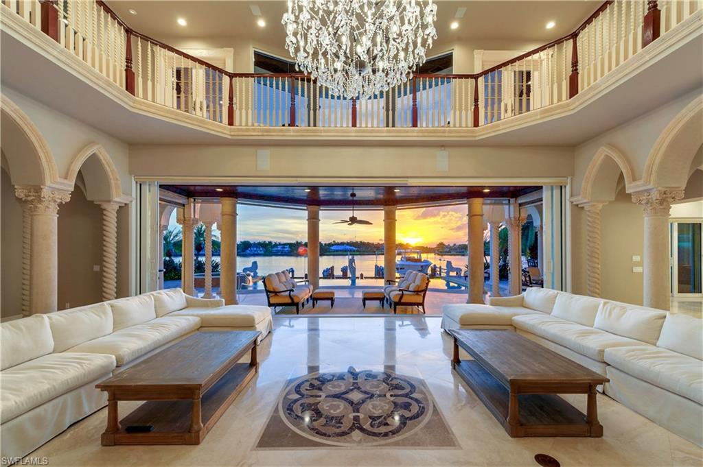 2300 Kingfish Road Naples, FL 34102 - Photo 9 of 36 a living room with furniture and a large window