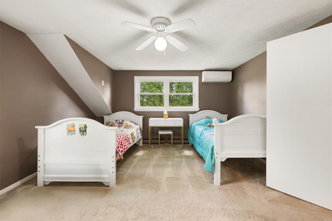 5120 Wheelock Road Troy, OH 45373 - Photo 29 of 67 This spacious bedroom offers ample natural light and comfortable carpeting, perfect for relaxation.