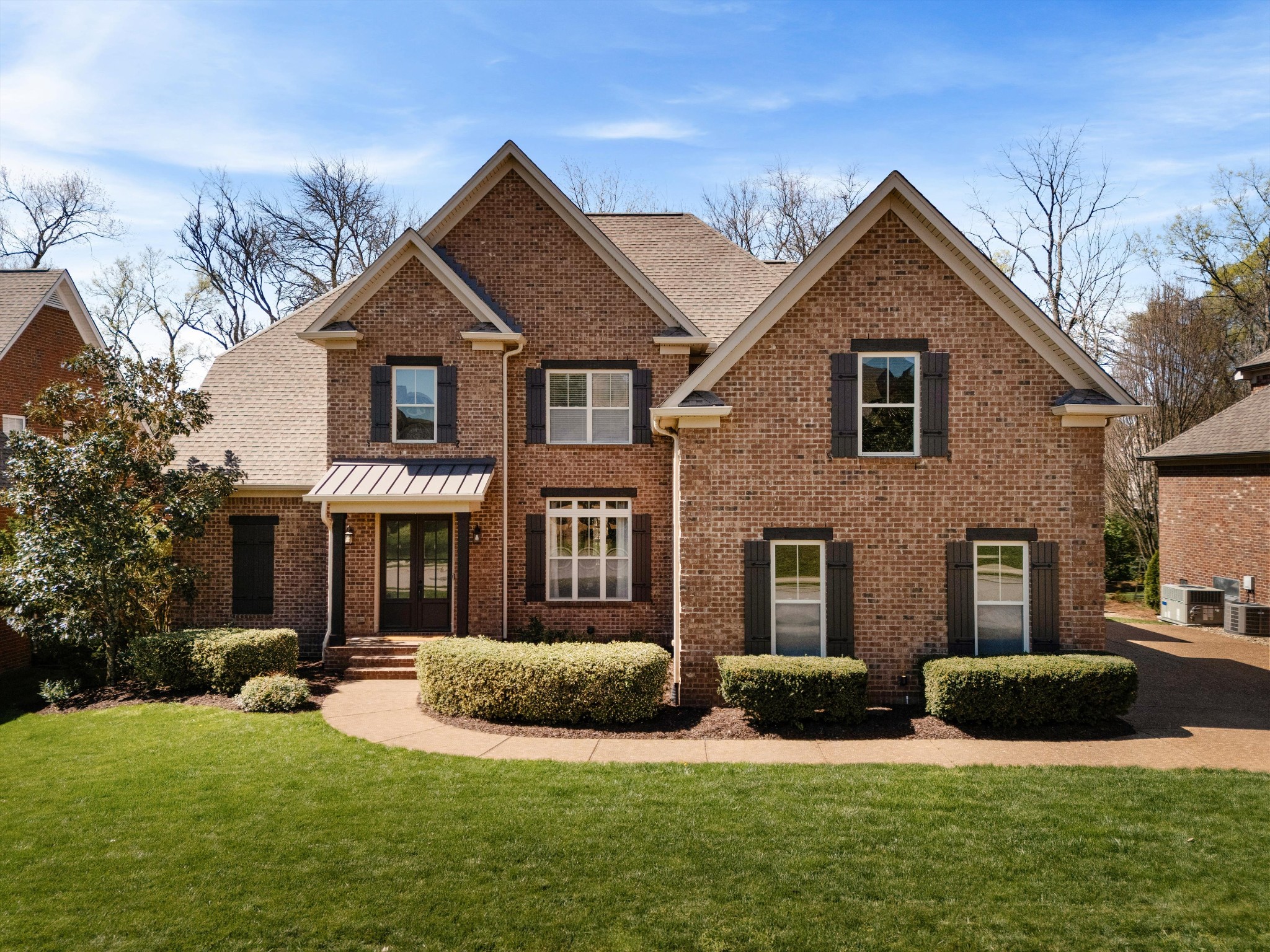 1058 Alice Springs Circle Spring Hill, TN 37174 - Photo 1 of 54 a front view of a house with a yard and garage