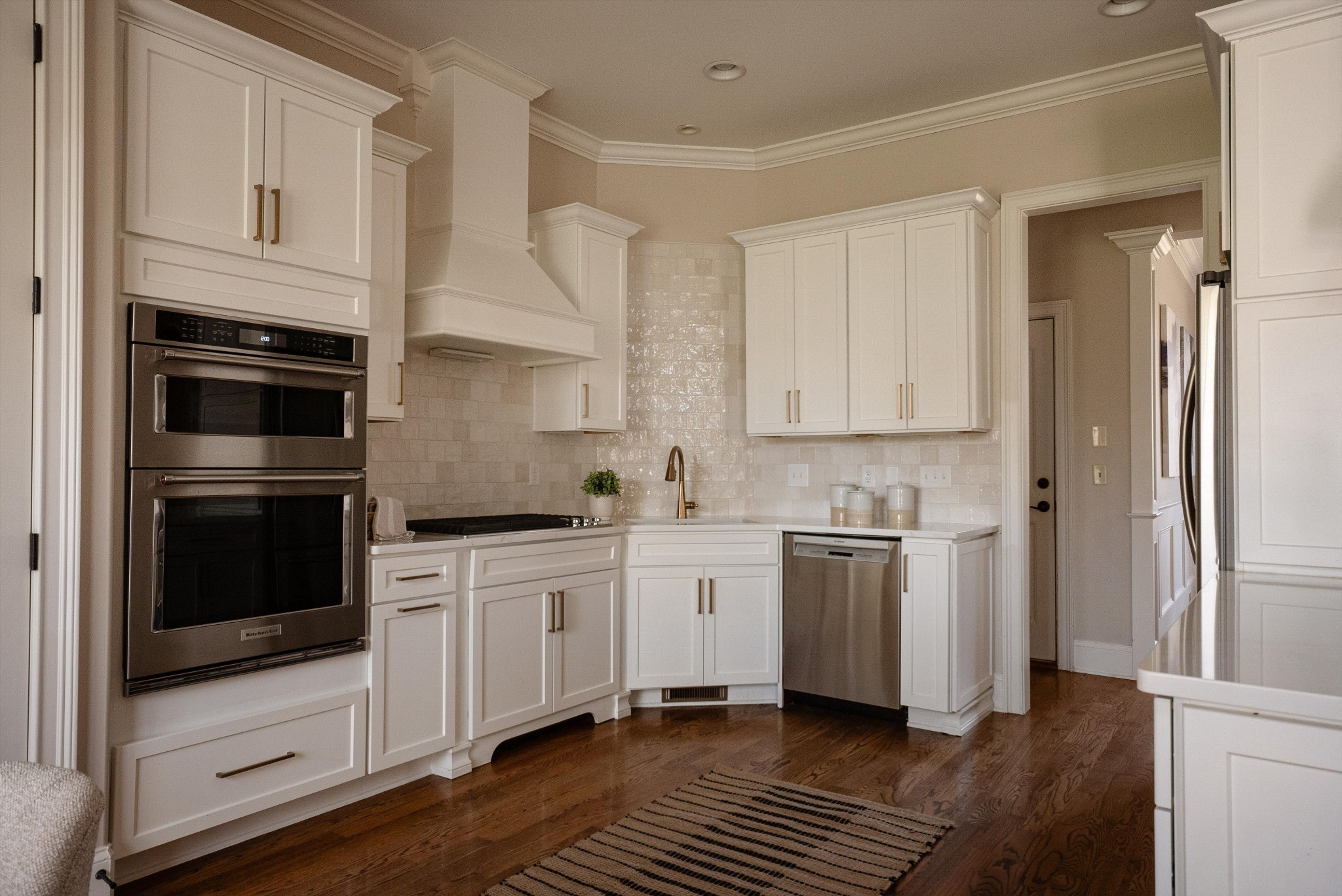 1058 Alice Springs Circle Spring Hill, TN 37174 - Photo 15 of 54 a kitchen with stainless steel appliances white cabinets and a stove