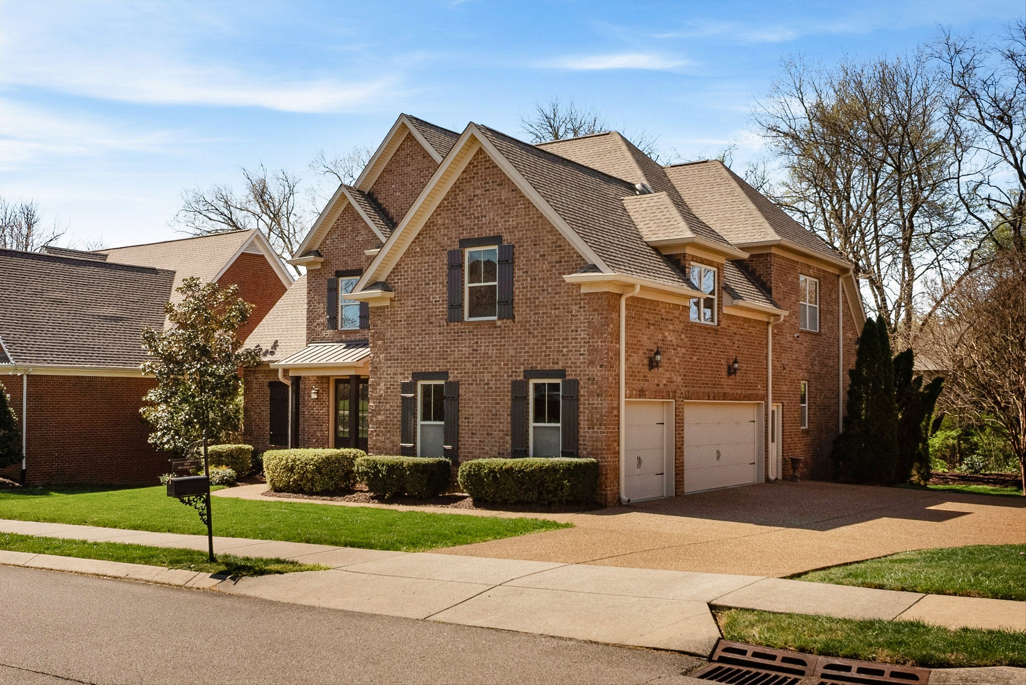 1058 Alice Springs Circle Spring Hill, TN 37174 - Photo 2 of 54 a front view of a house with a yard and garage