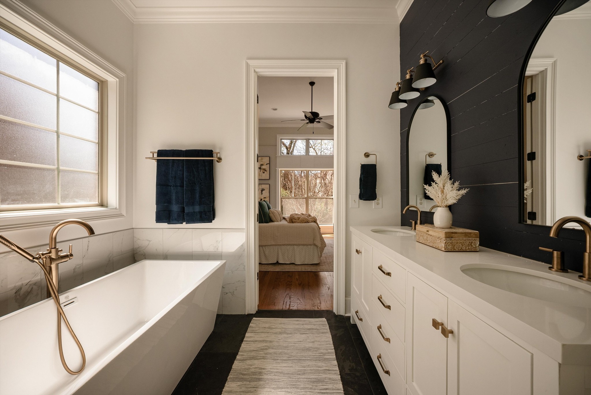 1058 Alice Springs Circle Spring Hill, TN 37174 - Photo 24 of 54 a bathroom with a tub sink double vanity and window
