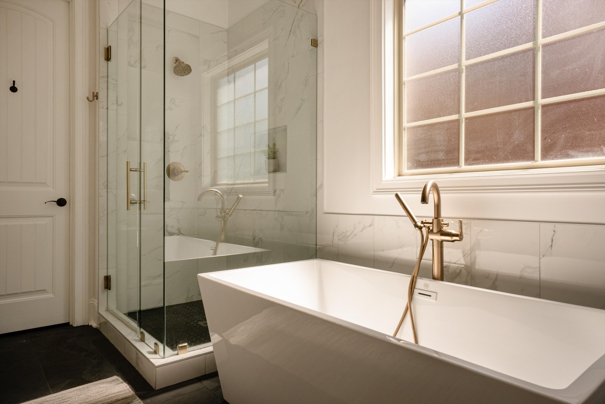 1058 Alice Springs Circle Spring Hill, TN 37174 - Photo 25 of 54 a bathroom with a tub and a shower