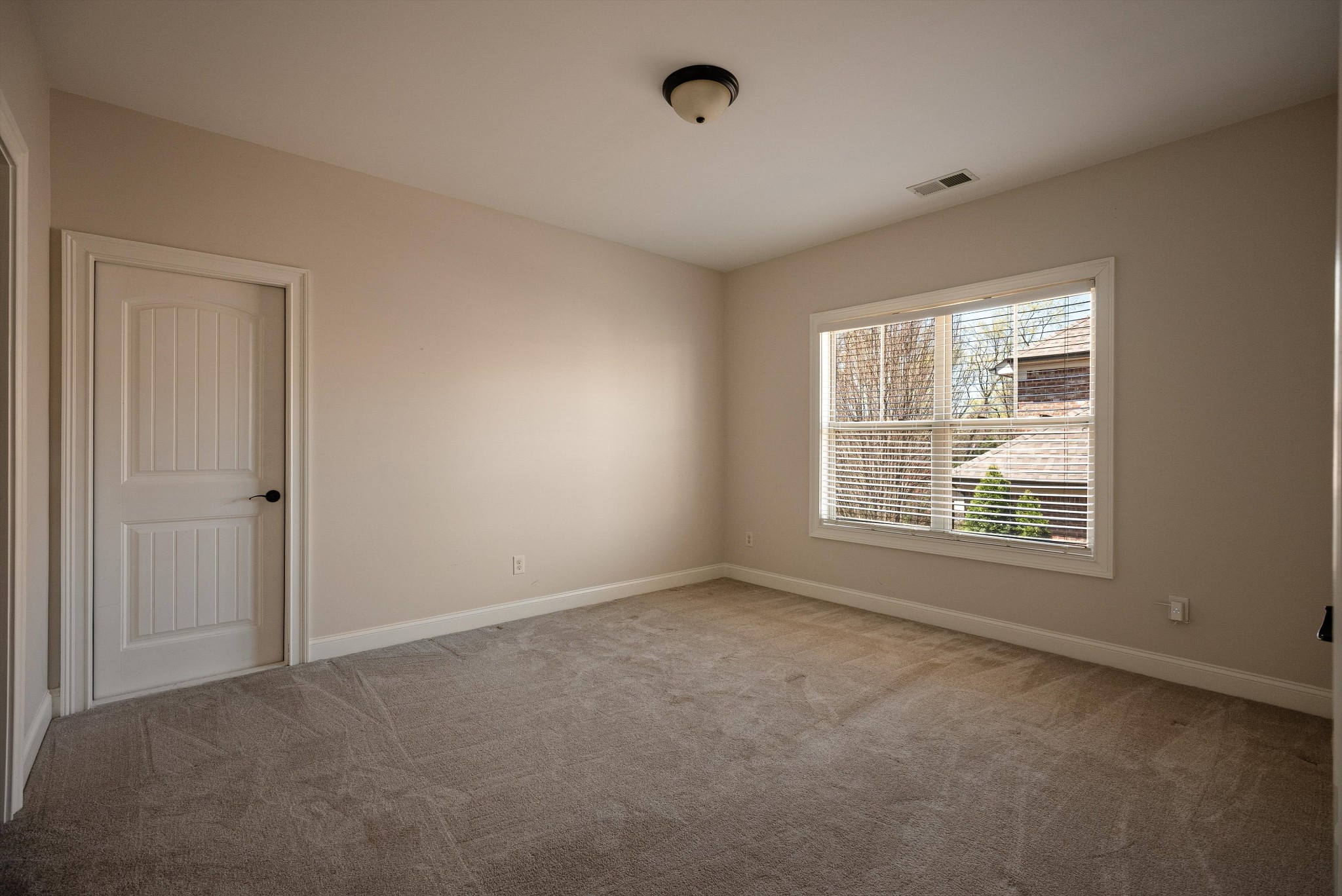 1058 Alice Springs Circle Spring Hill, TN 37174 - Photo 44 of 54 a view of an empty room with a window