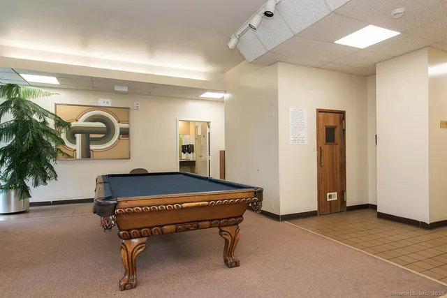 a room with a table chairs and entryway