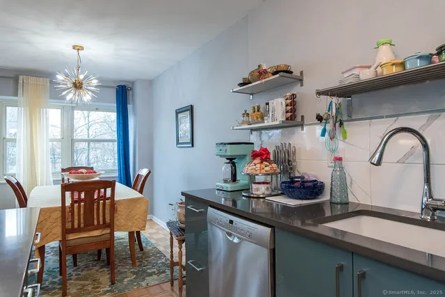 a dining room with furniture and window
