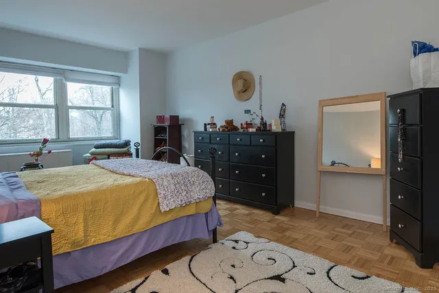 a bed room with a bed and a television