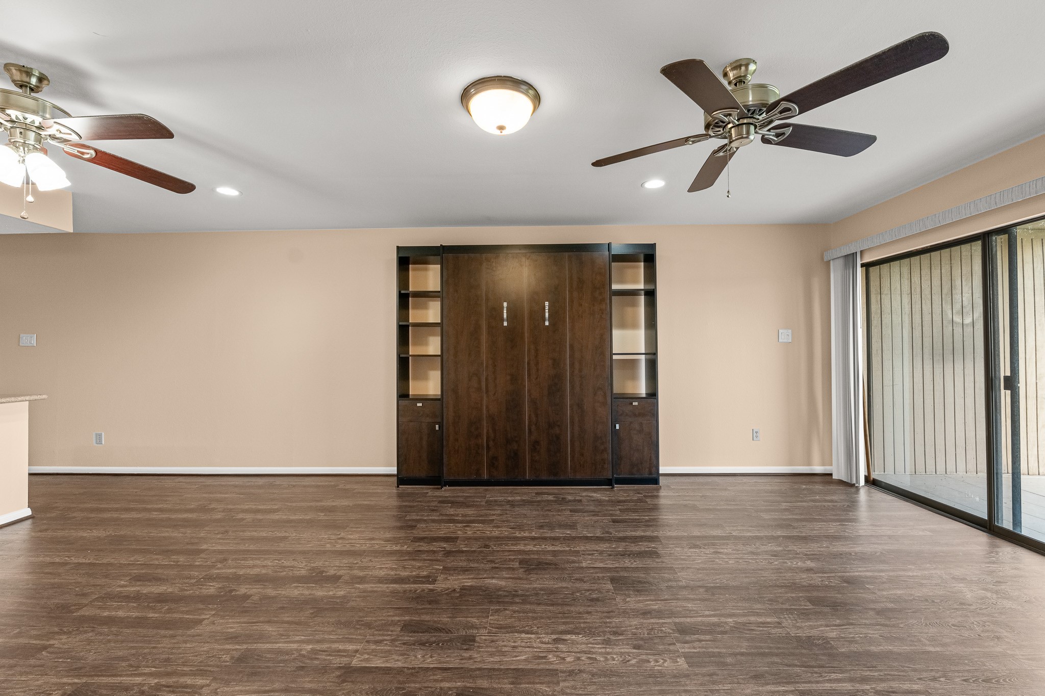 15575 Marina Drive, Unit 215C Montgomery, TX 77356 - Photo 18 of 31 an empty room with wooden floor and windows