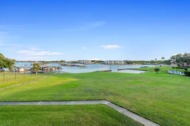 a view of a room with a large window and an entryway