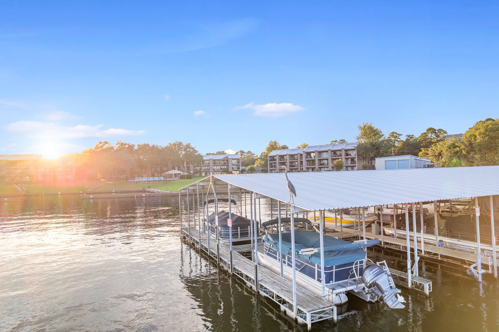 15575 Marina Drive, Unit 215C Montgomery, TX 77356 - Photo 29 of 31 a view of a lake with a city from a lake
