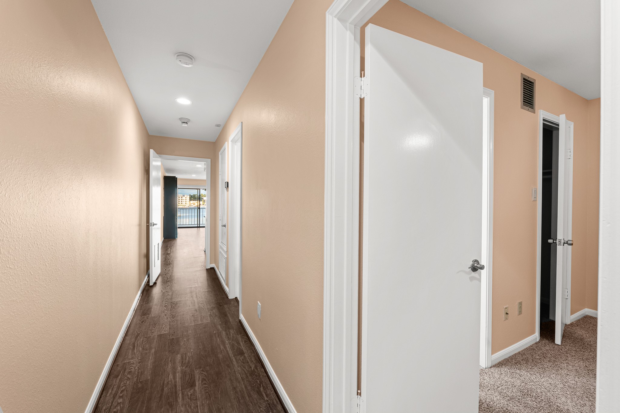 15575 Marina Drive, Unit 215C Montgomery, TX 77356 - Photo 4 of 31 a view of a hallway with wooden floor