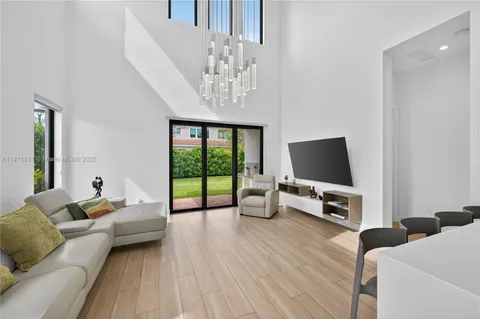 a bathroom with a sink vanity and shower