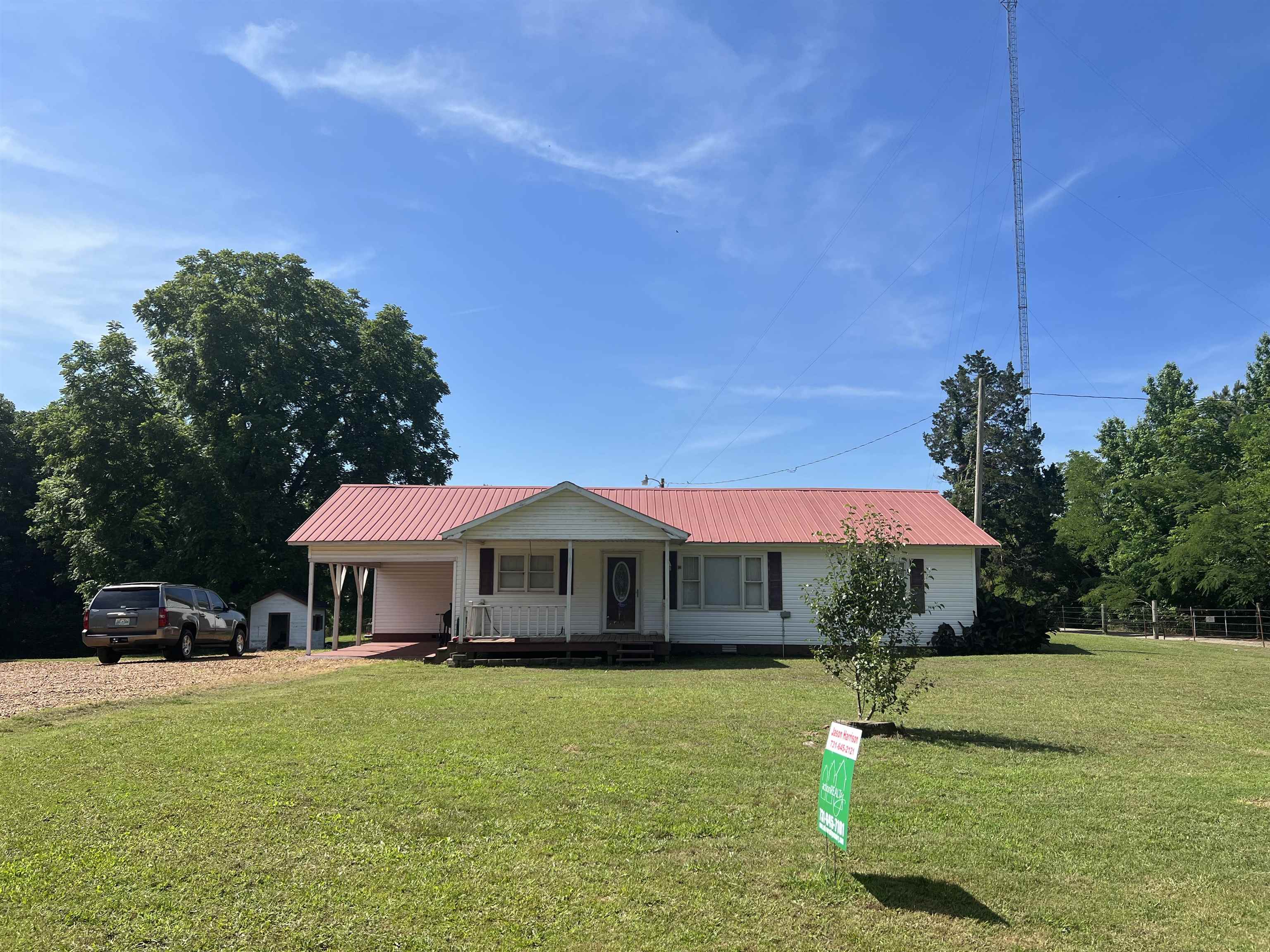 2388 Chambers Store Road Michie, TN 38357 - Photo 1 of 13 a front view of a house with swimming pool yard fire pit and outdoor seating