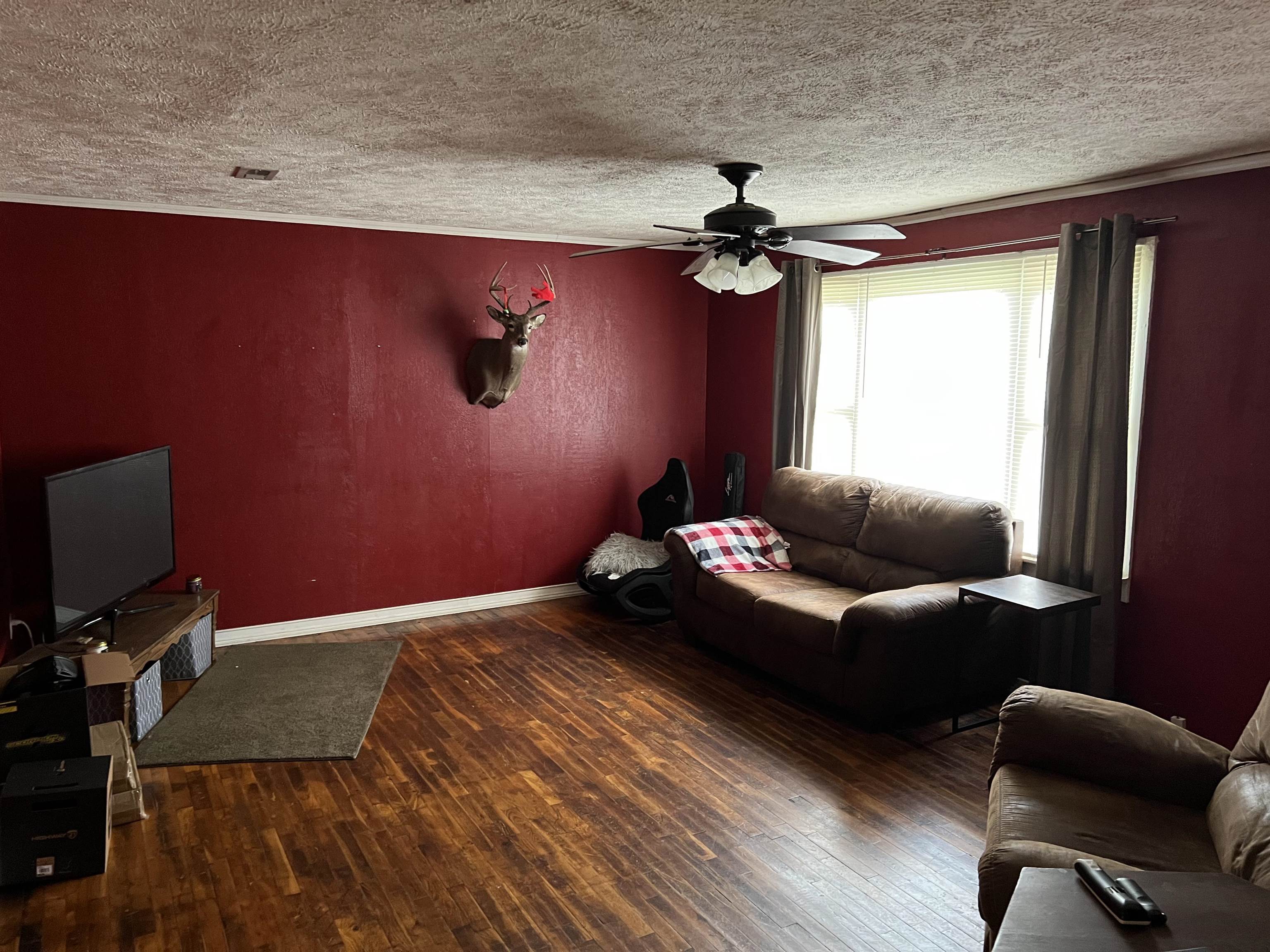 2388 Chambers Store Road Michie, TN 38357 - Photo 5 of 13 a living room with furniture and a flat screen tv