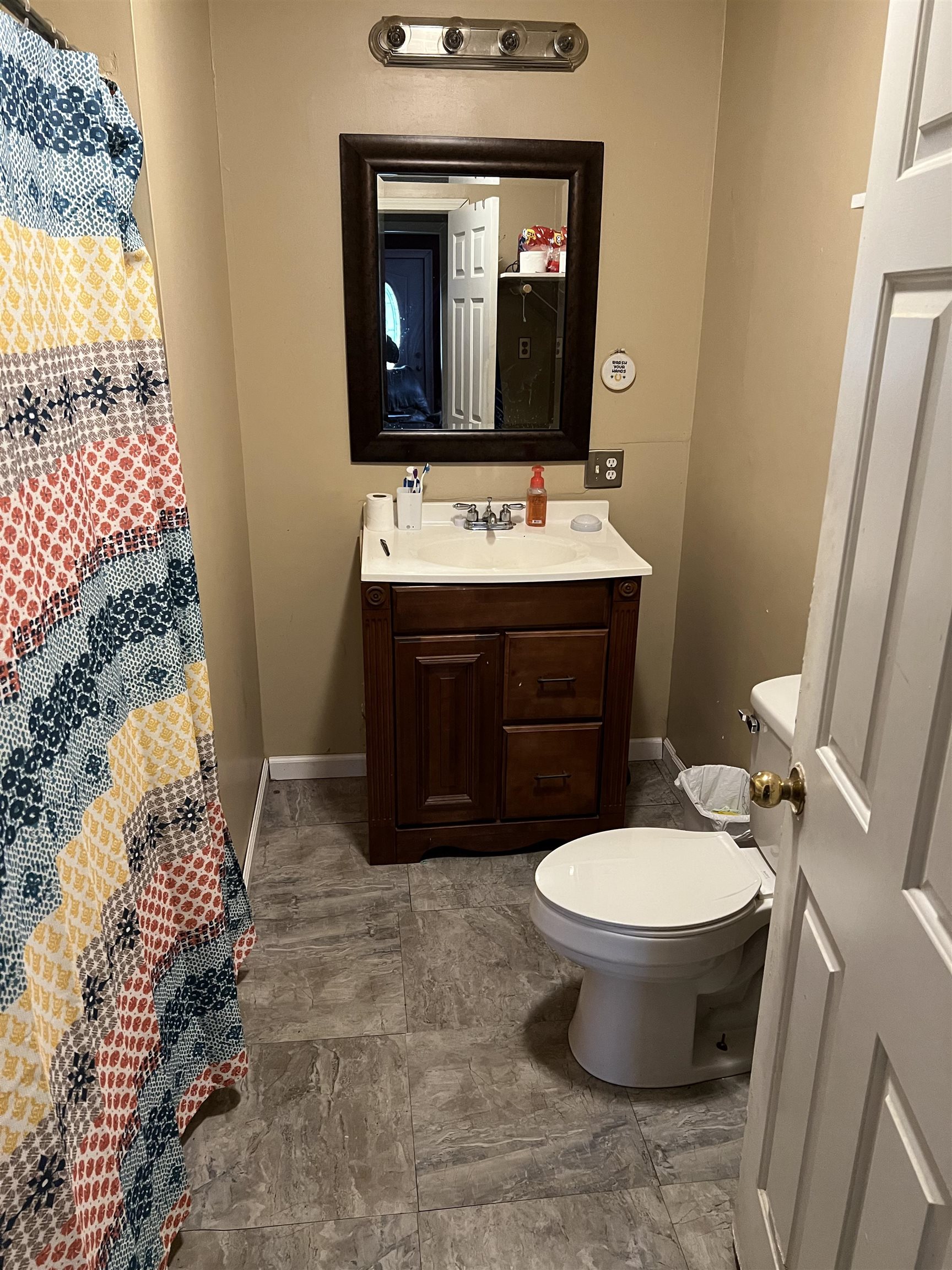 2388 Chambers Store Road Michie, TN 38357 - Photo 7 of 13 a bathroom with a sink toilet and mirror