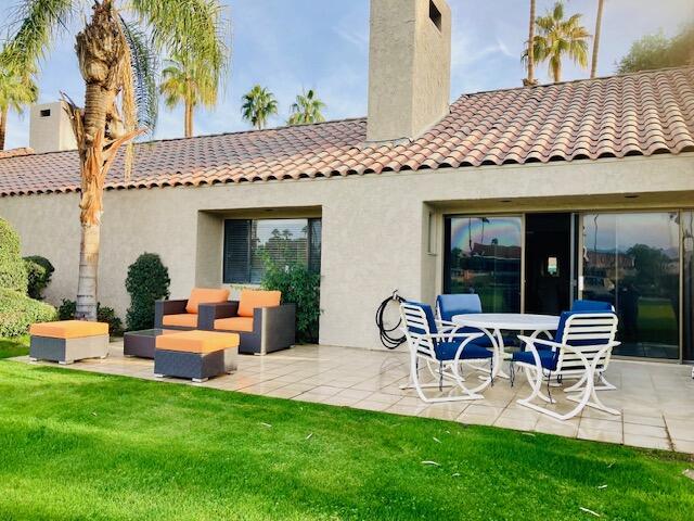 118 Racquet Club Drive South Rancho Mirage, CA 92270 - Photo 2 of 33 a view of a house with backyard and sitting area