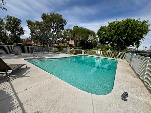 a view of a swimming pool with a sitting area