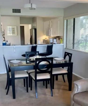 a view of a dining room with furniture