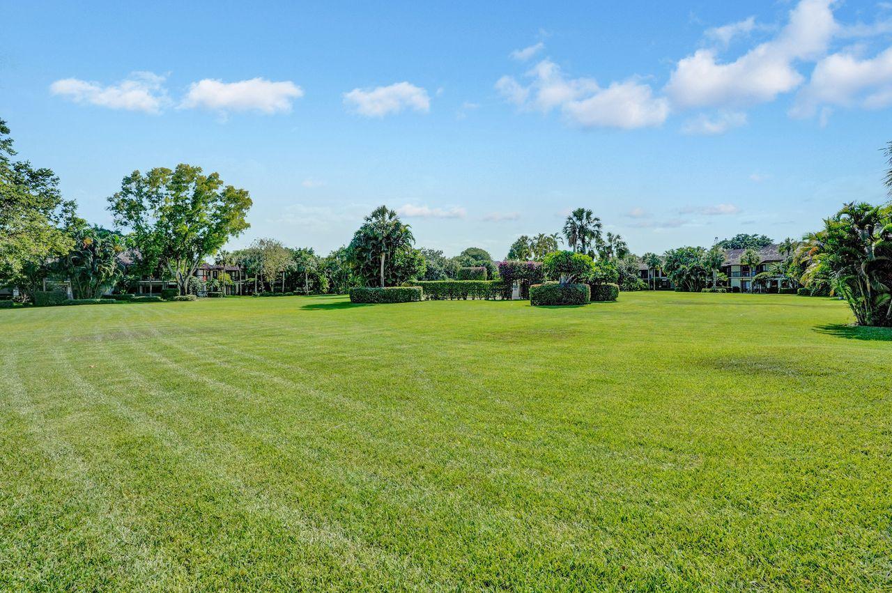 13334 Polo Club Road, Unit 230 Wellington, FL 33414 - Photo 40 of 46 Backyard to Pool Area