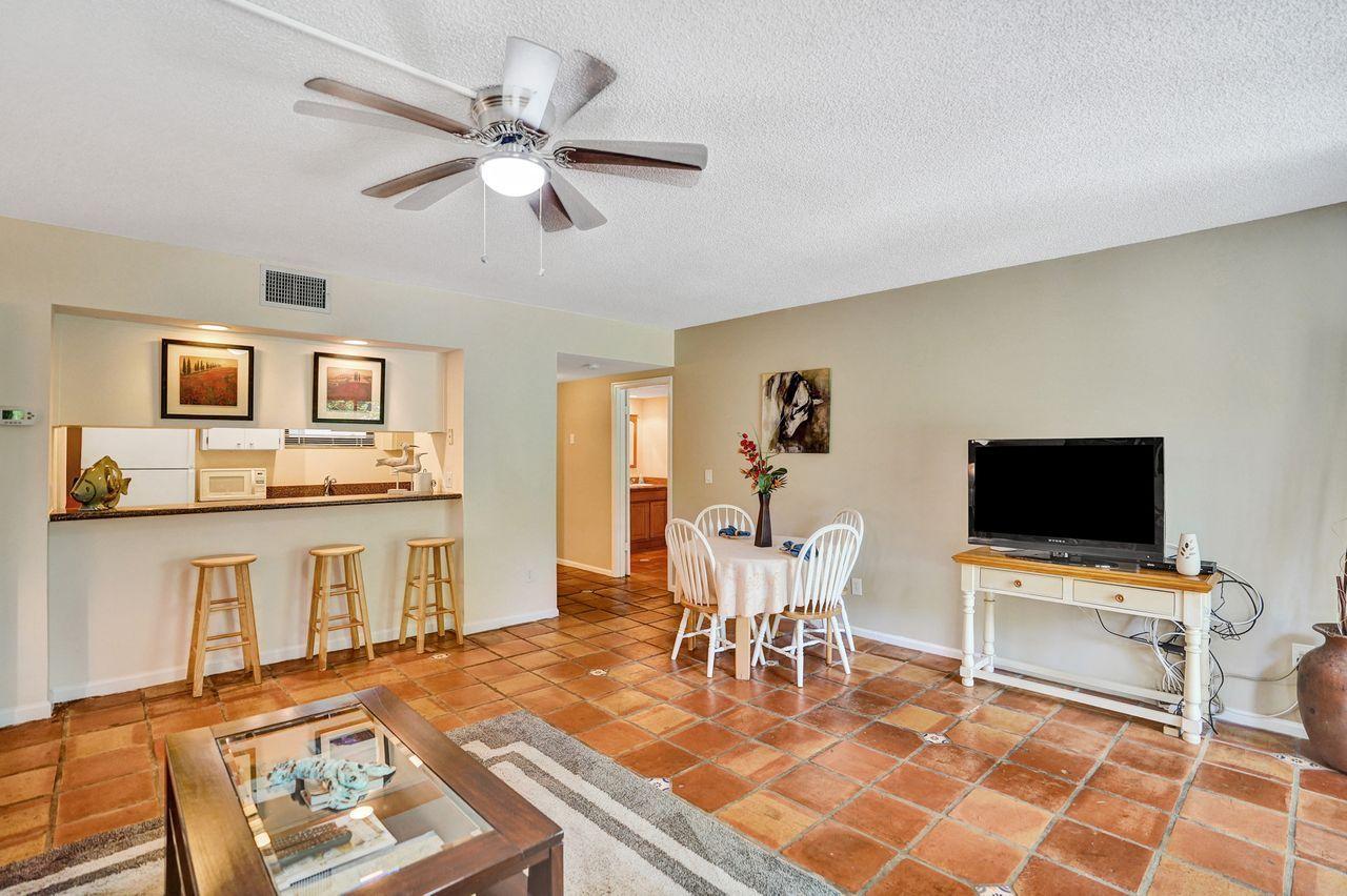 13334 Polo Club Road, Unit 230 Wellington, FL 33414 - Photo 7 of 46 Living Area to Kitchen