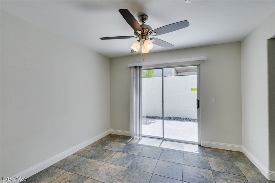 200 Luninborg Street Henderson, NV 89074 - Photo 18 of 40 A well-lit room opens to a private patio through expansive sliding doors.