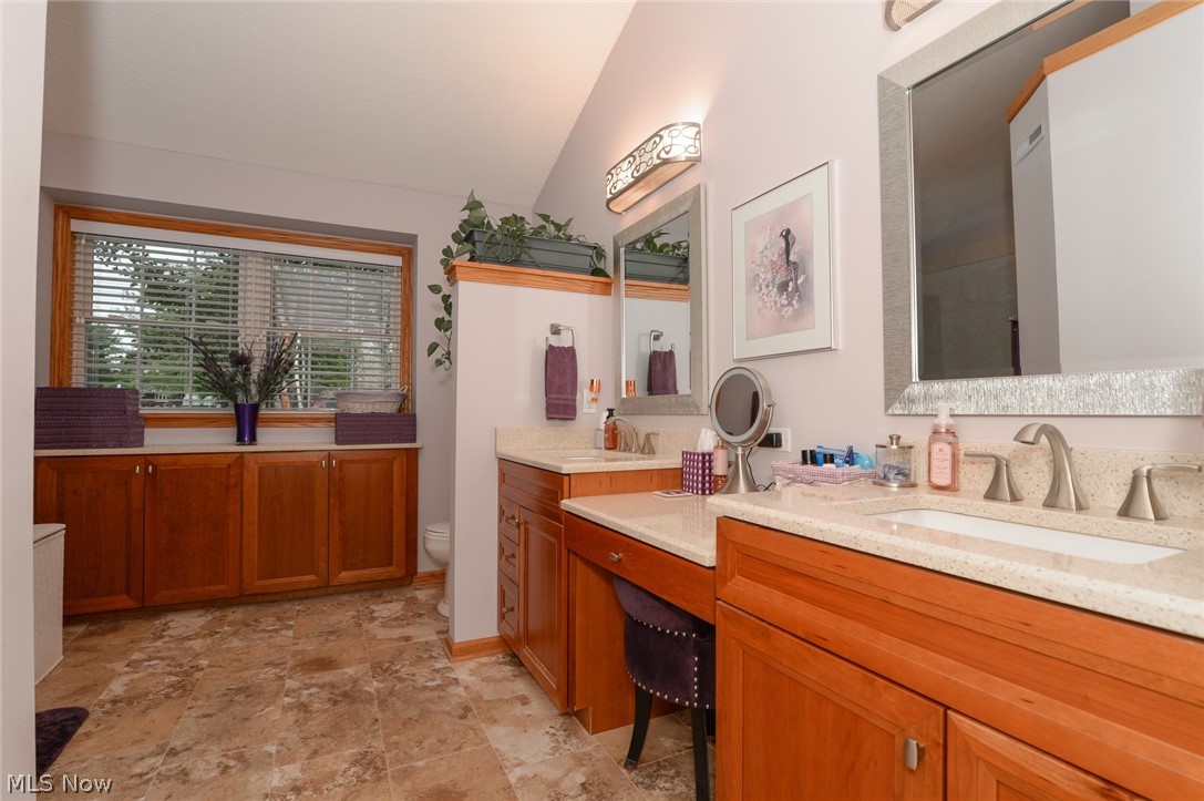 4490 Fenn Road Medina, OH 44256 - Photo 15 of 35 The updated master bath offers a double vanity, tile shower and a heated floor.
