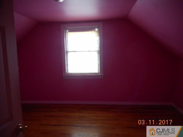 123 Vineyard Road Edison, NJ 08817 - Photo 11 of 14 a view of an empty room with a window