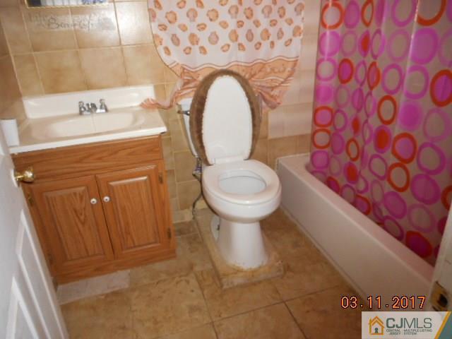 123 Vineyard Road Edison, NJ 08817 - Photo 14 of 14 a bathroom with a granite countertop toilet and a sink