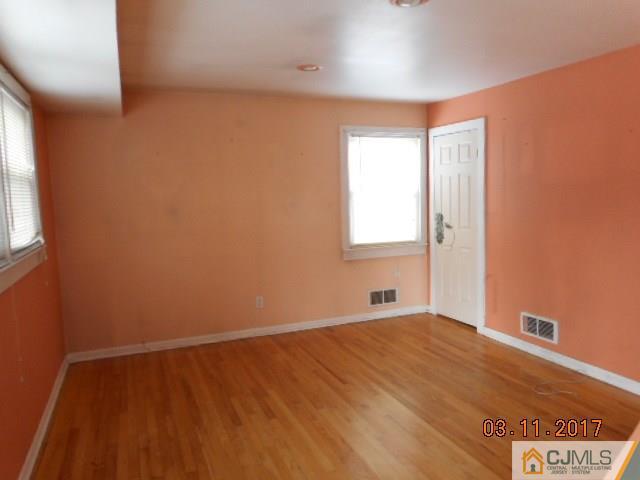 123 Vineyard Road Edison, NJ 08817 - Photo 4 of 14 a view of an empty room with a window