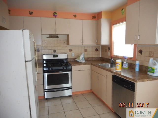 123 Vineyard Road Edison, NJ 08817 - Photo 7 of 14 a kitchen with stainless steel appliances a stove a sink and a refrigerator