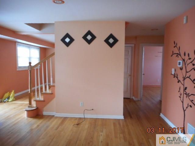 123 Vineyard Road Edison, NJ 08817 - Photo 8 of 14 an entryway with wooden floor