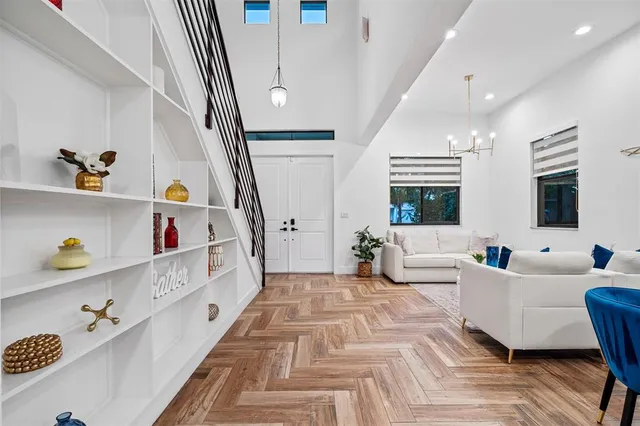 a large white bedroom with furniture