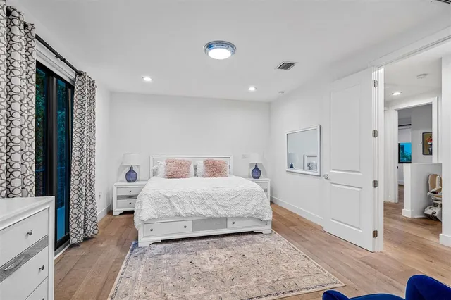 a bedroom with a bed and a dresser