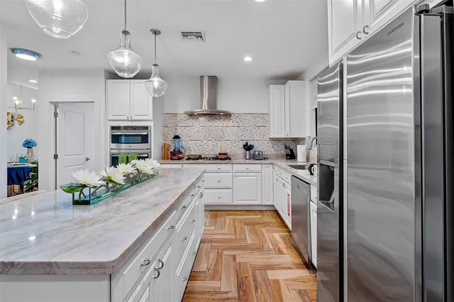 a large kitchen with cabinets