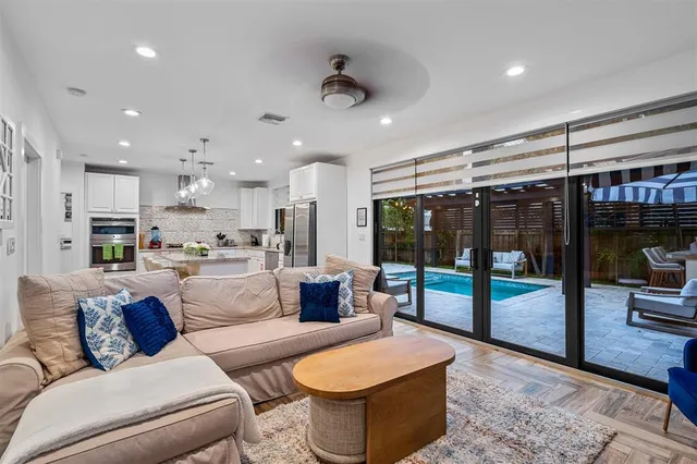 a living room with furniture and a large window