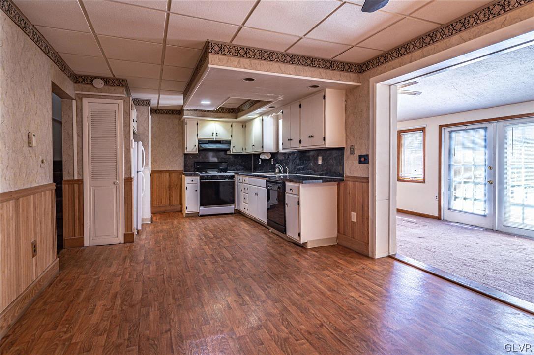 1177 Arcadia Street Bethlehem, PA 18018 - Photo 9 of 32 a kitchen with stainless steel appliances wooden floors and refrigerator
