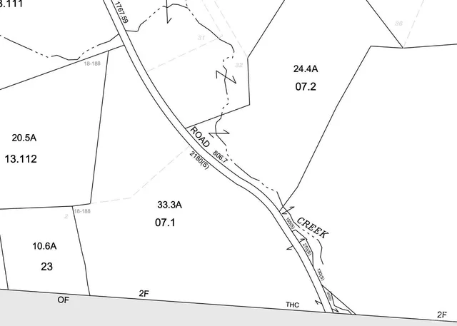 a view of a tree in a yard