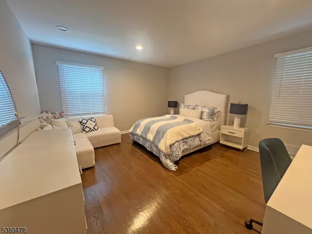 a bed room with a bed and a chair