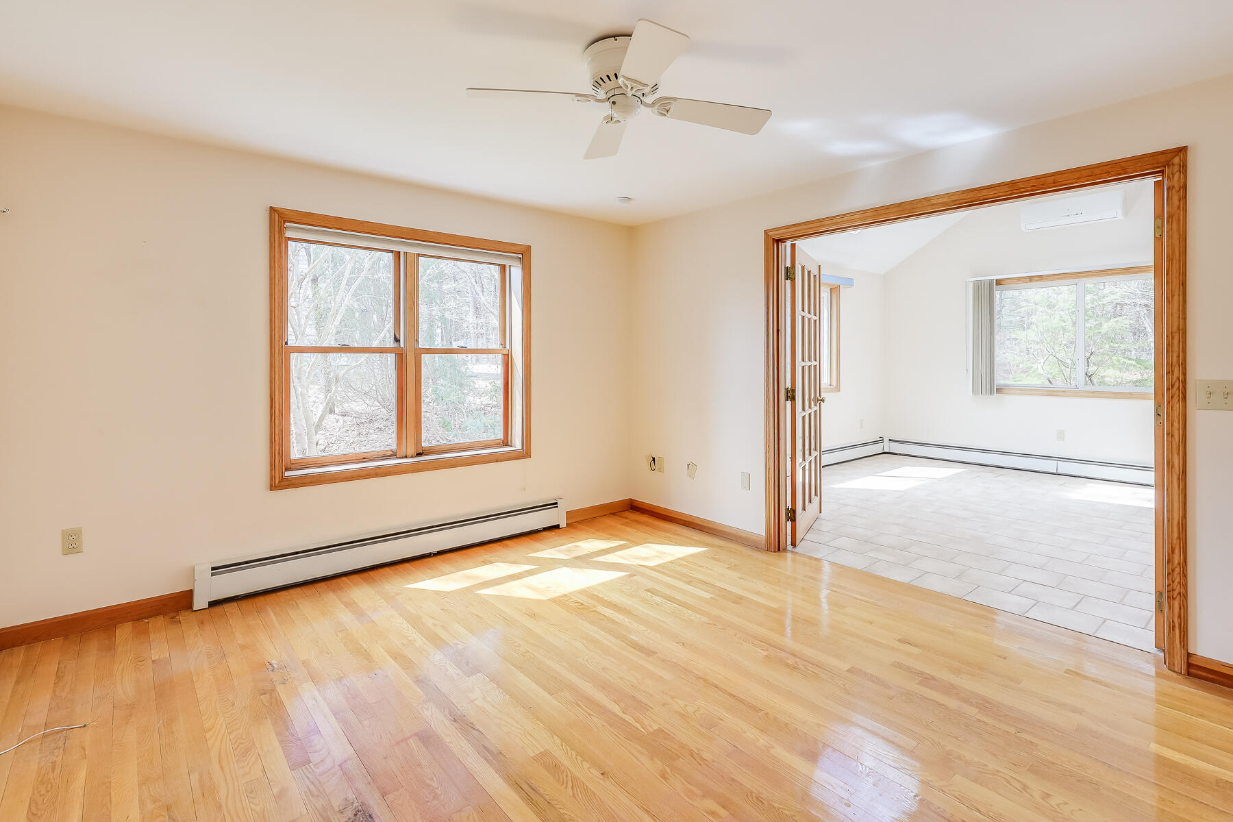 40 Meadowbrook Road Mashpee, MA 02649 - Photo 12 of 31 a view of an empty room with a window and wooden floor
