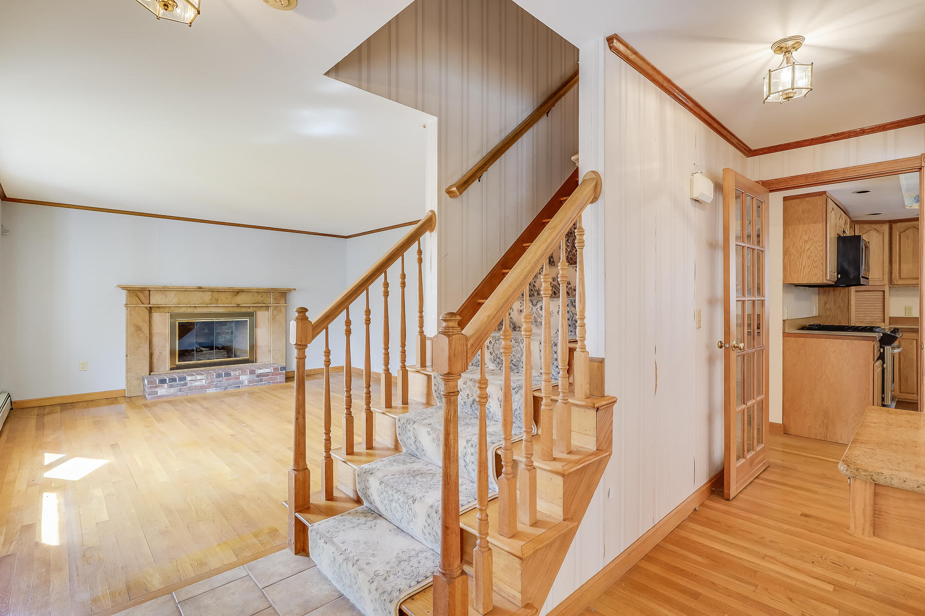 40 Meadowbrook Road Mashpee, MA 02649 - Photo 15 of 31 a view of a hallway with wooden floor and staircase