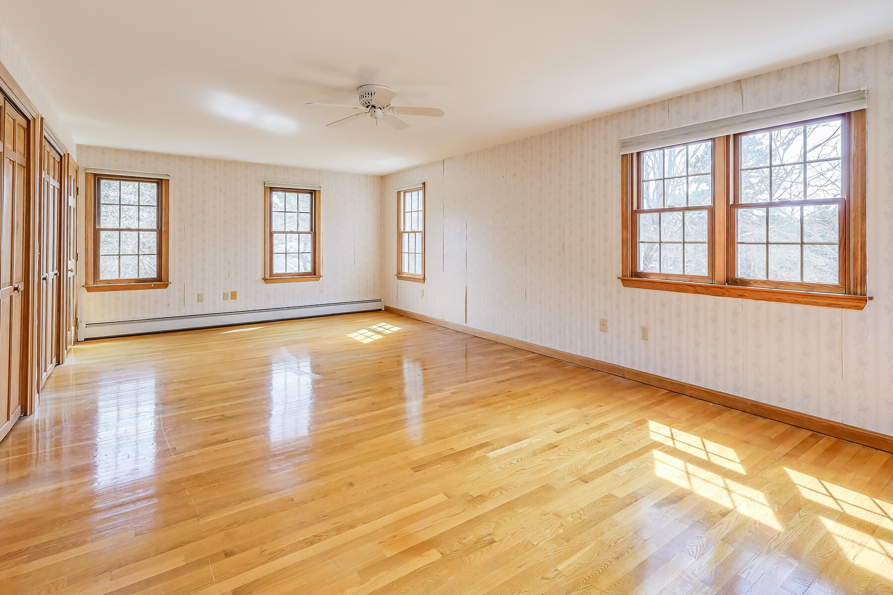 40 Meadowbrook Road Mashpee, MA 02649 - Photo 16 of 31 a view of empty room with wooden floor and fan
