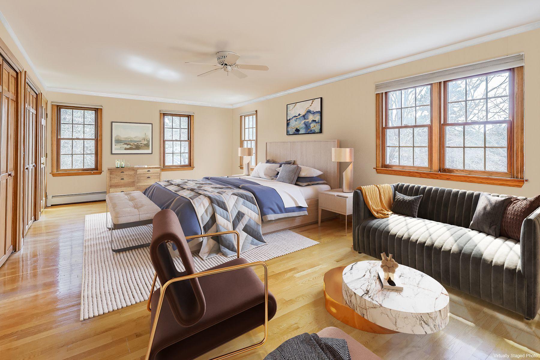 40 Meadowbrook Road Mashpee, MA 02649 - Photo 17 of 31 a bed room with a bed and a couch