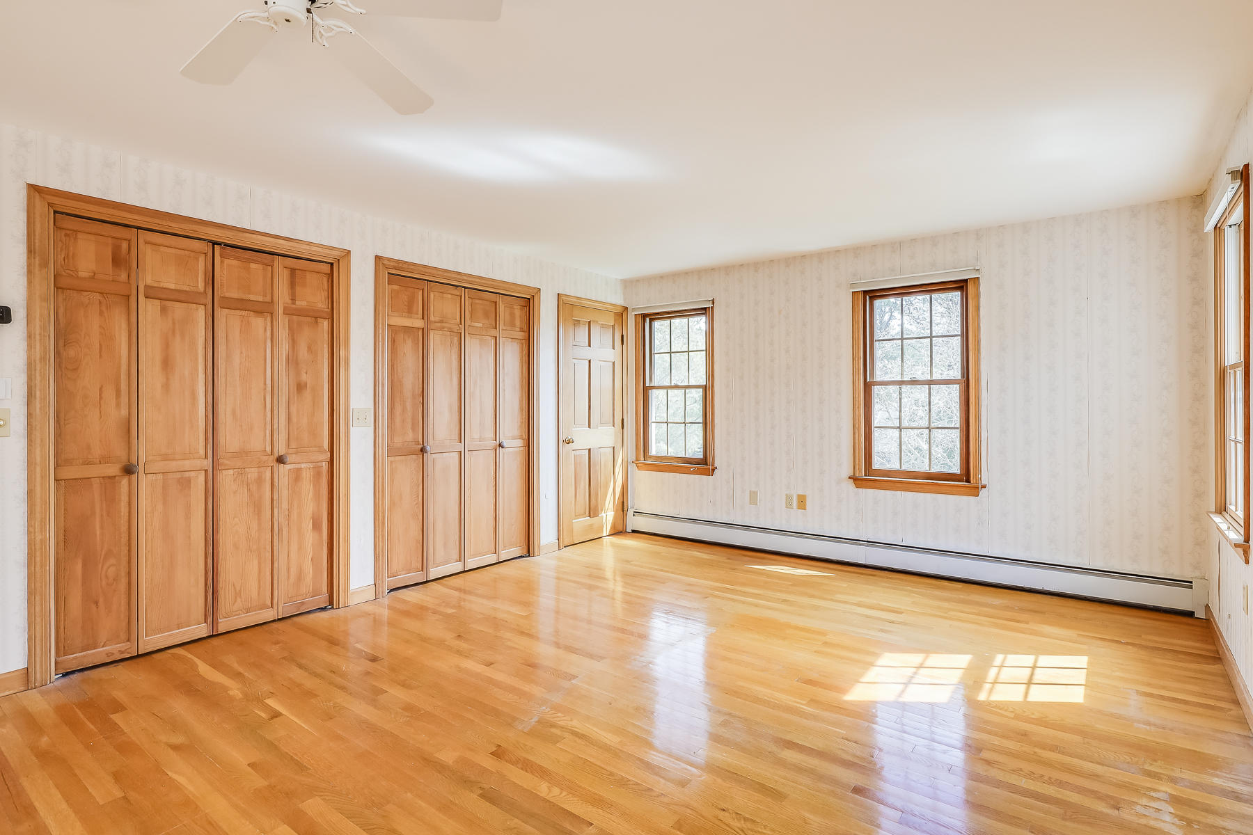 40 Meadowbrook Road Mashpee, MA 02649 - Photo 18 of 31 a view of an empty room with window and wooden floor